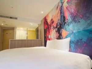 Voodi või voodid majutusasutuse Artinn藝築文旅-台北站前館 toas