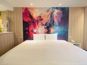 Voodi või voodid majutusasutuse Artinn藝築文旅-台北站前館 toas