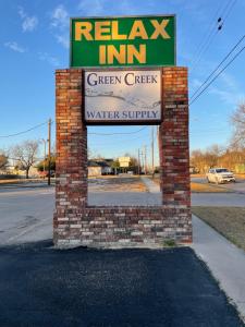 a sign for a green creek water supply at Relax Inn Dublin in Dublin