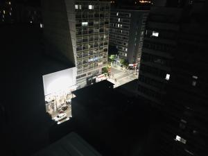 an overhead view of a city at night at Aconchegante apartamento a Copacabana in Rio de Janeiro
