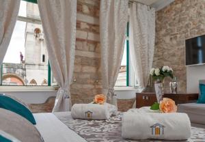 Ліжко або ліжка в номері Heritage Hotel Antique Split