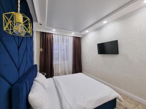 Katil atau katil-katil dalam bilik di Apartments Avrora