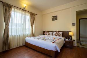 Rúm í herbergi á Siddhartha Boutique Hotel, Boudha