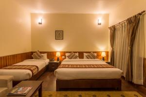 Rúm í herbergi á Siddhartha Boutique Hotel, Boudha