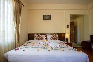 Rúm í herbergi á Siddhartha Boutique Hotel, Boudha