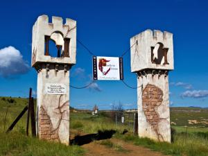 a pair of stone gates in a field at Castle in Clarens in Clarens
