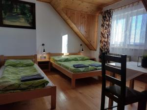 Postel nebo postele na pokoji v ubytování Jurajska Chata