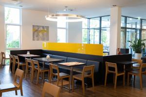Uma área de estar em Star G Hotel Premium München Domagkstraße