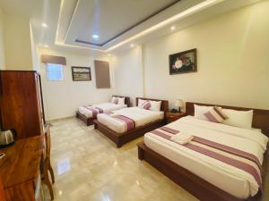 Voodi või voodid majutusasutuse Hoang Quan Hotel toas