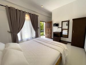 Letto o letti in una camera di The Reef Resort