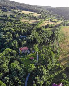 an aerial view of a house in the middle of a field at Art Pension in Przecznica