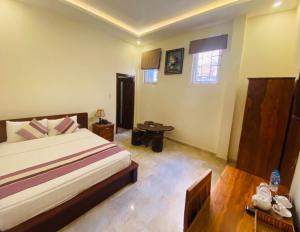 Voodi või voodid majutusasutuse Hoang Quan Hotel toas