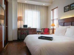 Voodi või voodid majutusasutuse Hanoi E Central Luxury Hotel & Restaurant toas
