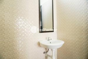 Koupelna v ubytování Griya Imafa Inn RedPartner near Jatim Park 2
