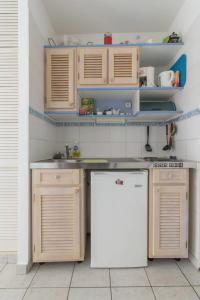 Kuchyň nebo kuchyňský kout v ubytování Un pied-à-terre face à la marina