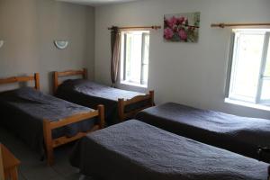 Ένα ή περισσότερα κρεβάτια σε δωμάτιο στο Le Coq en Pâte