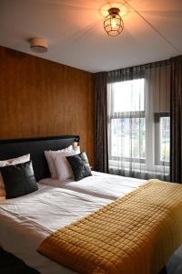 Кровать или кровати в номере Slot Hotel Schagen