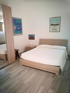 A bed or beds in a room at Le Vigne di Clementina Fabi