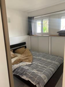 Ліжко або ліжка в номері Appartement en résidence climatisé avec parking