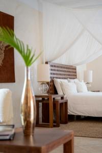 Uma cama ou camas num quarto em Lion in the Sun Billionaire Retreat Malindi