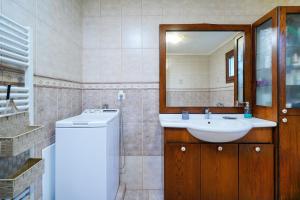 a bathroom with a sink and a mirror at il giardino in Skala Kallirakhis +38 photos