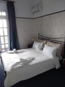 
מיטה או מיטות בחדר ב-Elafos Hotel
