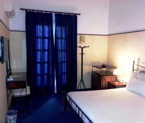 Postel nebo postele na pokoji v ubytování Elafos Hotel
