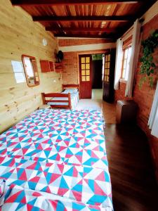 Ένα ή περισσότερα κρεβάτια σε δωμάτιο στο Hostel Aroeira do campo