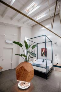 Postel nebo postele na pokoji v ubytování FICOPALA SUITES