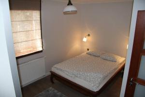 En eller flere senge i et værelse på Chata rybacka w Orłowie / Apartament