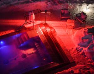 an overhead view of a swimming pool at night at Gudauri Lodge in Gudauri
