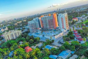 an aerial view of a city with tall buildings at Apartment X Palm Village Mikocheni in Dar es Salaam