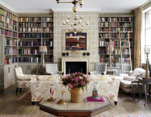 a living room filled with furniture and a fireplace at Ham Yard Hotel, Firmdale Hotels in London