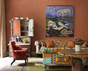 a living room with a couch and a table at Ham Yard Hotel, Firmdale Hotels in London