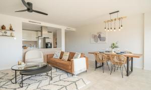 a living room with a couch and a table at AR 17 South Bay in Estepona