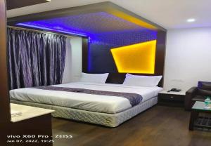 Postel nebo postele na pokoji v ubytování Hotel M Grand