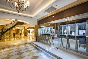 a shopping mall with a chandelier and display windows at Karmir Resort & Spa - Ultra All Inclusive in Kemer