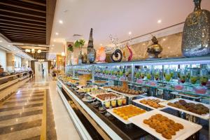 a display case in a mall filled with lots of food at Karmir Resort & Spa - Ultra All Inclusive in Kemer