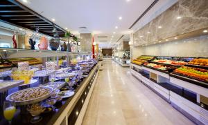 a buffet line with many different types of food at Karmir Resort & Spa - Ultra All Inclusive in Kemer