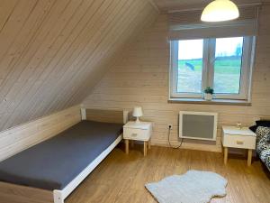 Posteľ alebo postele v izbe v ubytovaní Domek Całoroczny Fuleda -Mazury Giżycko Sauna Jacuzii Kominek