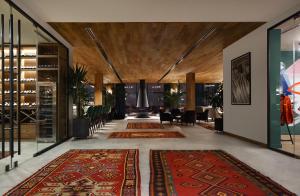 a hallway with several rugs on the floor in a building at Gudauri Lodge in Gudauri