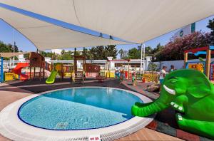 a playground with an elephant and a swimming pool at Karmir Resort & Spa - Ultra All Inclusive in Kemer
