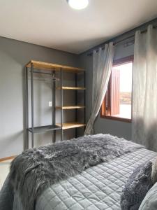 Cama ou camas em um quarto em Refúgio dos Coiotes