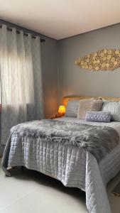 Cama ou camas em um quarto em Refúgio dos Coiotes