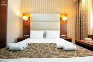 Postel nebo postele na pokoji v ubytování 4-you Residence + 45 fotografií