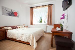 Llit o llits en una habitació de Pensjonat Bogdanka