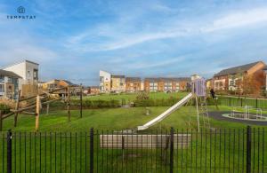 a playground with a slide in a park at STYLISH 4 BED FAMILY HOME AT MADEJSKI, READING UNIVERSITY in Reading