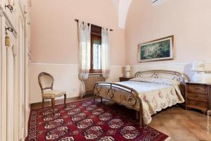Un pat sau paturi într-o cameră la Villa Delle Palme