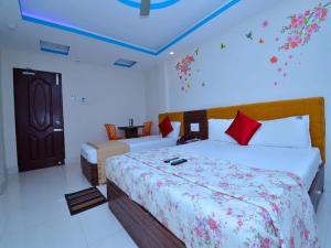 Llit o llits en una habitació de The Tamarind Tree Hotel