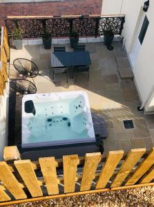 a jacuzzi tub sitting on a patio at Artro House in Pembrokeshire